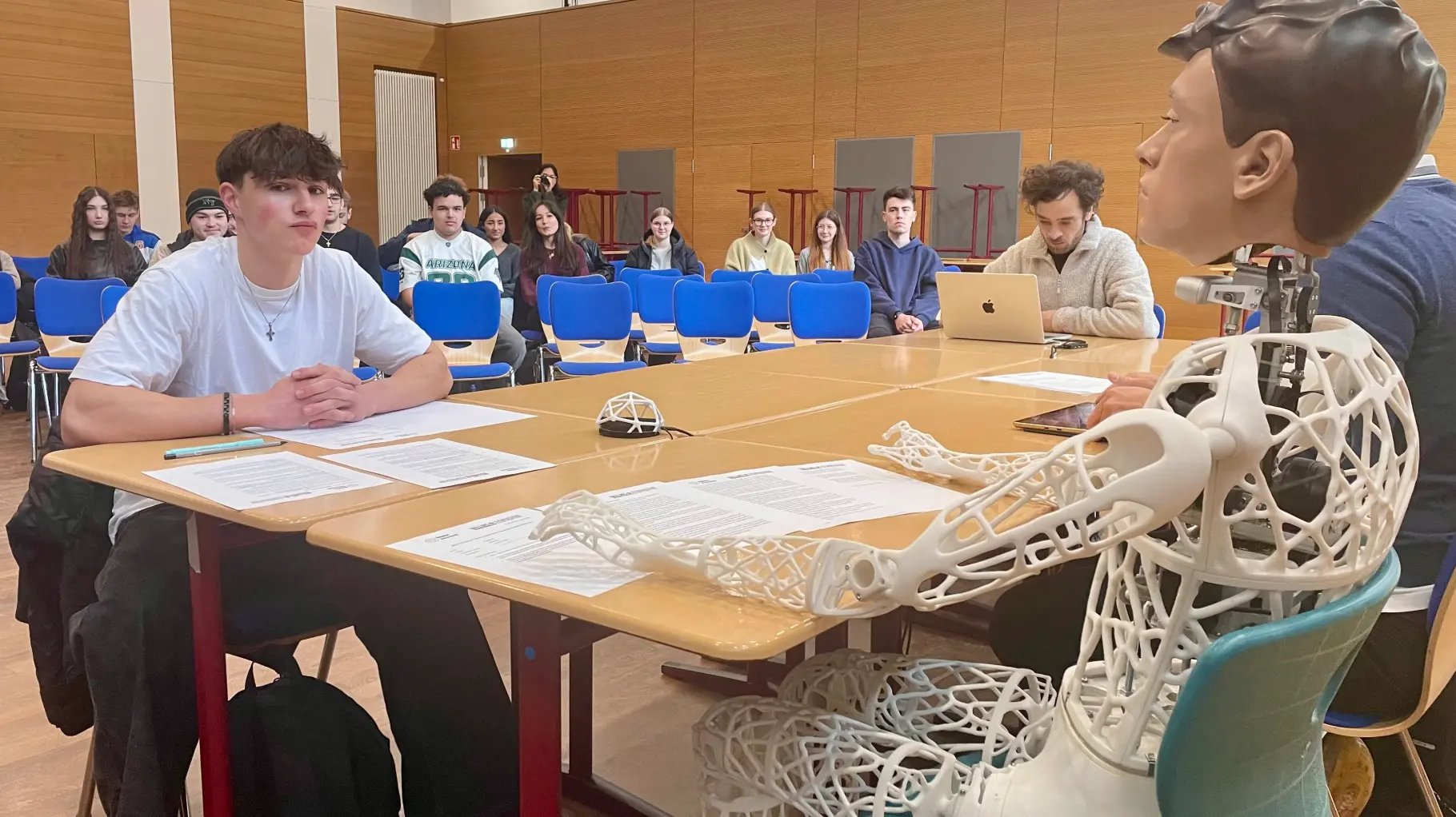 Captcha robot taking an oral exam with students